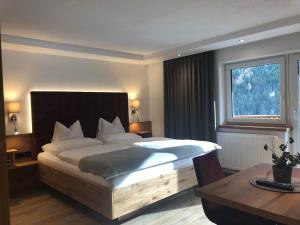 Ένα ή περισσότερα κρεβάτια σε δωμάτιο στο Hotel Garni Central - Zimmer - Studios - Apartments