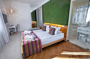 Posteľ alebo postele v izbe v ubytovaní Platinum Residence Boutique