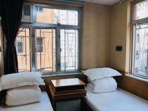 Postel nebo postele na pokoji v ubytování Good Fortune Inn + 14 fotografií
