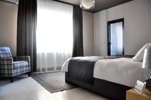 Postel nebo postele na pokoji v ubytování Rubio Residence - Frateria Apartment