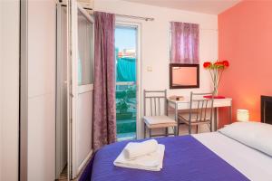 Postel nebo postele na pokoji v ubytování Damira Rooms