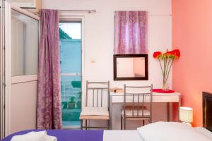 Postel nebo postele na pokoji v ubytování Damira Rooms