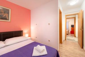 Postel nebo postele na pokoji v ubytování Damira Rooms