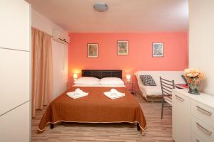 Postel nebo postele na pokoji v ubytování Damira Rooms
