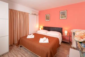 Postel nebo postele na pokoji v ubytování Damira Rooms