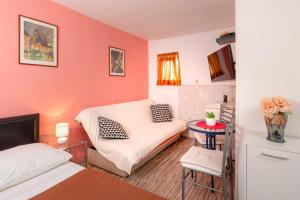 Postel nebo postele na pokoji v ubytování Damira Rooms