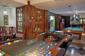a living room with a pool table and a billiard at Canadian Resort Huatulco in Santa Cruz Huatulco