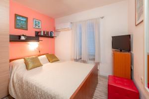 Postel nebo postele na pokoji v ubytování Damira Rooms