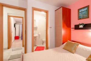 Postel nebo postele na pokoji v ubytování Damira Rooms