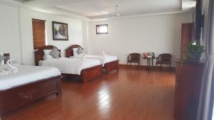 Postel nebo postele na pokoji v ubytování Bonsai Villa Hoi An
