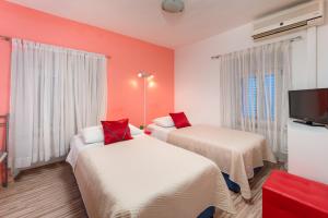 Postel nebo postele na pokoji v ubytování Damira Rooms