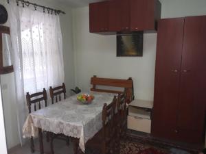 a dining room table with a bowl of fruit on it at Villa Vrben in Vrben