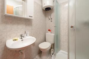 Koupelna v ubytování Damira Rooms + 37 fotografií