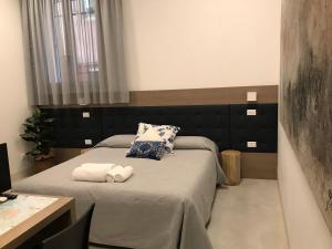 Postel nebo postele na pokoji v ubytování Al Pozzo di Luce Venezia Suites