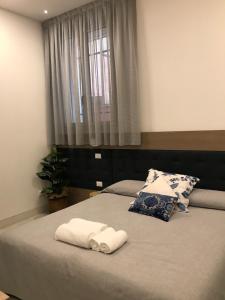 Postel nebo postele na pokoji v ubytování Al Pozzo di Luce Venezia Suites