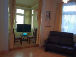 TV a/nebo společenská místnost v ubytování Hotel Alte Post