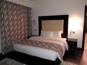 Voodi või voodid majutusasutuse Royal Maadi Hotel toas