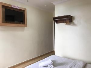Postel nebo postele na pokoji v ubytování Haji Saudi Hotel