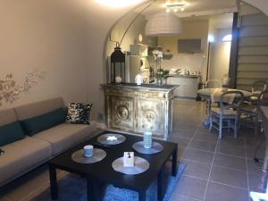 a living room with a couch and a table at la Salaberie in Villeréal