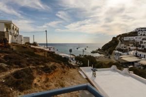 a view of the ocean from a building at Perigiali Rooms & Apartments Folegandros in Agali