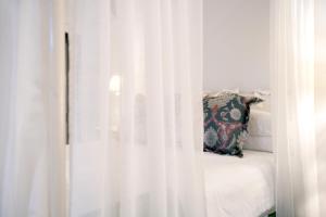 Łóżko lub łóżka w pokoju w obiekcie Suites de Franchy