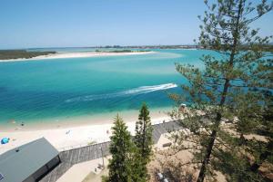
a beach with a large body of water at Cerulean Apartments in Caloundra
