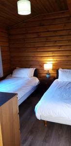 Voodi või voodid majutusasutuse Glenmhor Log Cabin toas