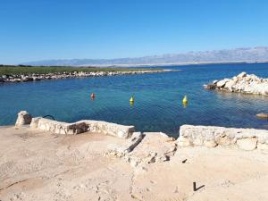 a large body of water with some yellow buoys in it at Apartment Aquamarine in Vir