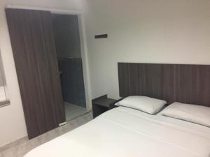 Postel nebo postele na pokoji v ubytování Hotel 42 Avenida