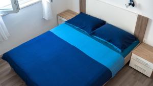 Postel nebo postele na pokoji v ubytování Apartments Ruzic