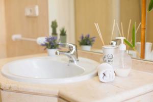a bathroom counter with a sink and a mirror at Loft Pasarela in Alicante +69 photos
