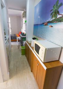 a kitchen with a microwave on a counter at Loft Pasarela in Alicante