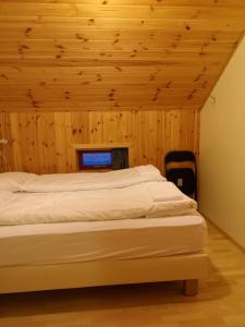 En eller flere senge i et værelse på Laugarfell Accommodation & Hot Springs