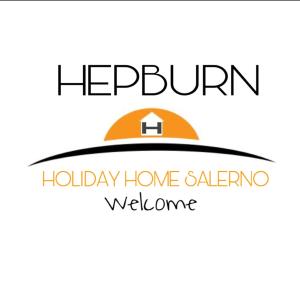 a sign for a holiday homealer with a house at Hepburn Holiday Home in Salerno