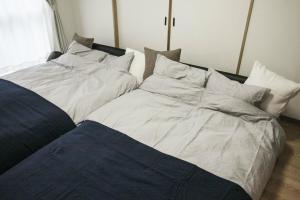 Кровать или кровати в номере Bios Hall / Vacation STAY 2177