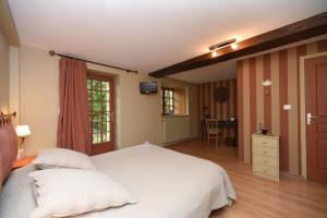 Postel nebo postele na pokoji v ubytování La Corrérie