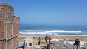 a view of the ocean from a building at Apartment Acogedor in Huanchaco