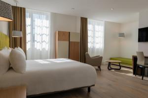 Postel nebo postele na pokoji v ubytování Hôtel Ginkgo - SPA Biloba