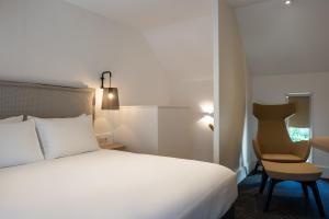 Postel nebo postele na pokoji v ubytování Hôtel Ginkgo - SPA Biloba