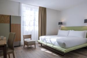 Postel nebo postele na pokoji v ubytování Hôtel Ginkgo - SPA Biloba