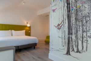 Postel nebo postele na pokoji v ubytování Hôtel Ginkgo - SPA Biloba