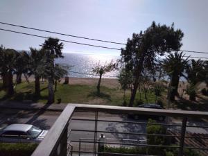 a view of the ocean from a balcony of a house at Two-storey Beachfront Maisonette in Toroni