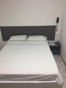 Postel nebo postele na pokoji v ubytování Hotel 42 Avenida