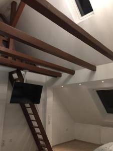 a room with wooden beams on the ceiling at LORENZ Apartment 2 in Hattingen