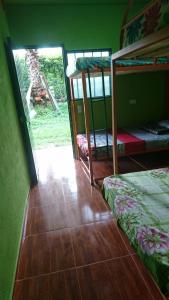 Postel nebo postele na pokoji v ubytování Hotel campestre la libertad