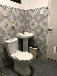 a bathroom with a toilet and a sink at Hadassah’s Place in Olango Island +31 photos