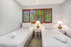 Ένα ή περισσότερα κρεβάτια σε δωμάτιο στο Private Apartments at Picture Point Noosa +26 φωτογραφίες
