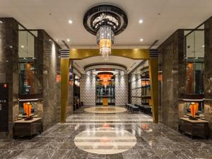a lobby of a building with a chandelier at APA Hotel TKP Sendai Eki Kita in Sendai