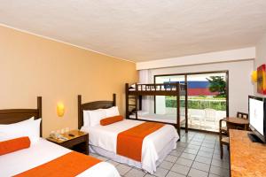 Postel nebo postele na pokoji v ubytování Flamingo Cancun All Inclusive