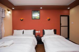 Voodi või voodid majutusasutuse Gurung's Home toas